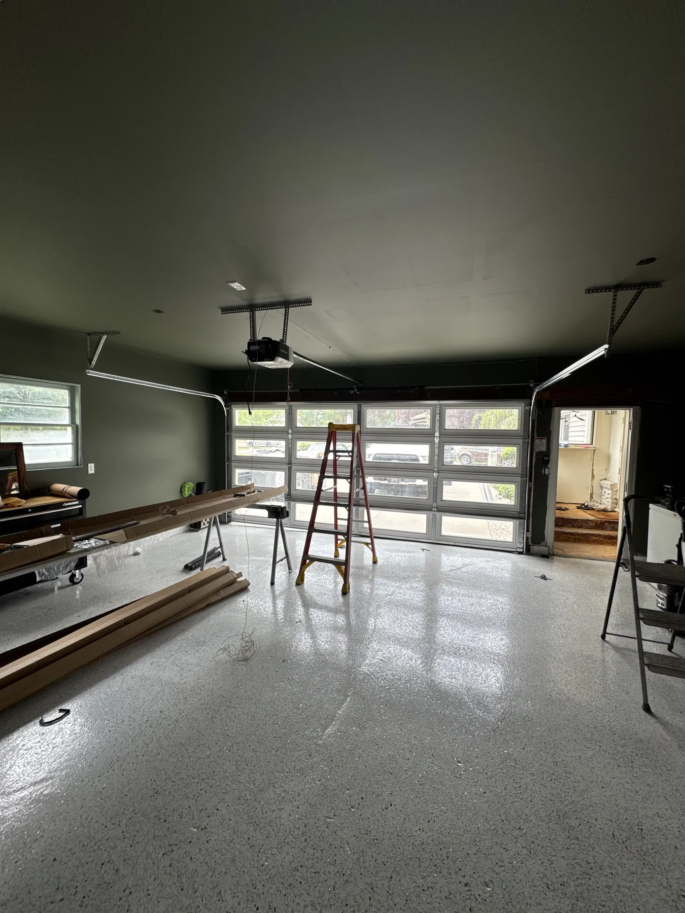 Finished full-view garage door viewed from inside a completed garage