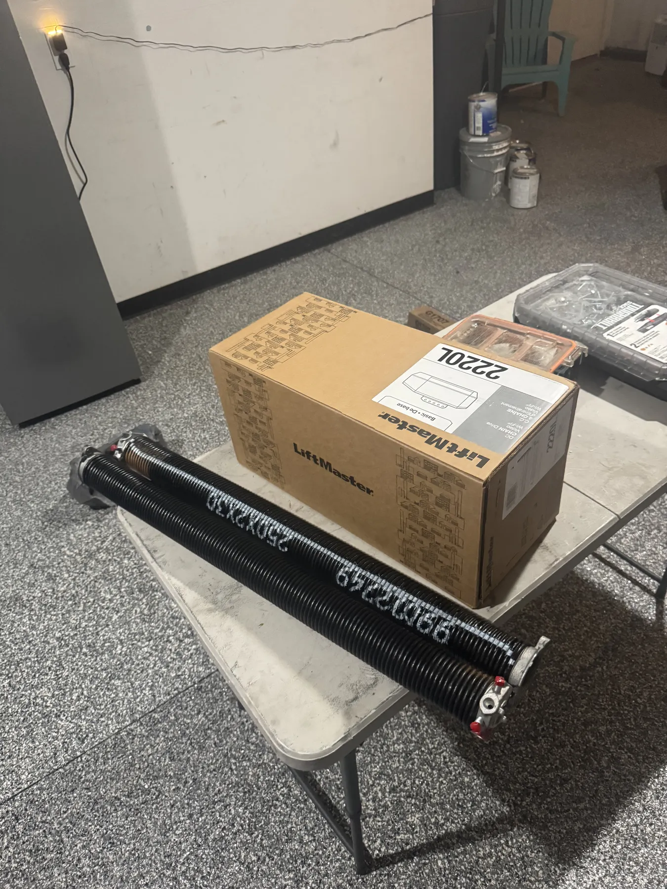 LiftMaster garage door opener and matched torsion springs prepared for a LIFTX installation